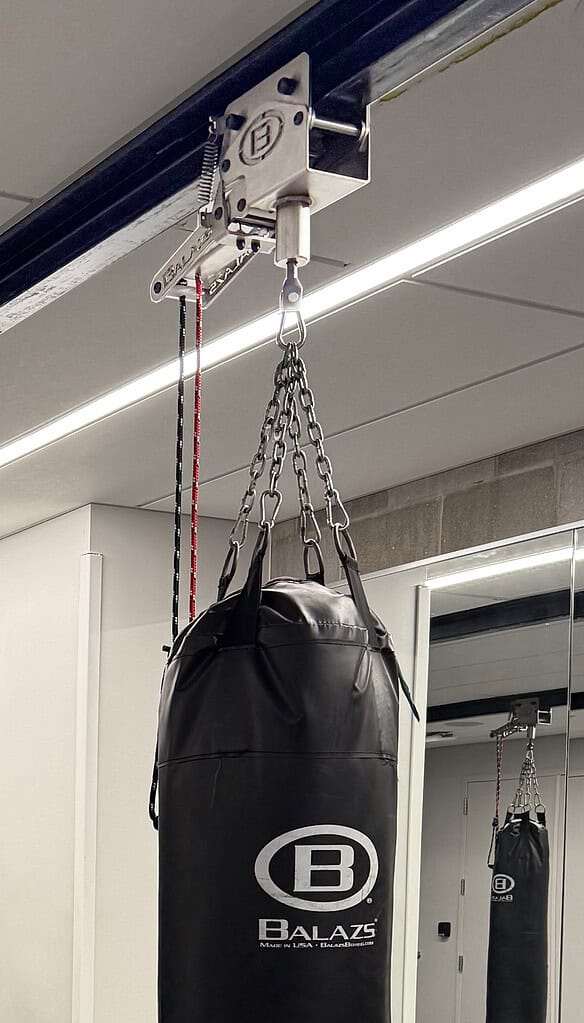 Heavy bag hanging from a Balazs Ultra-Trak II trolley with chain assembly and H2S spring