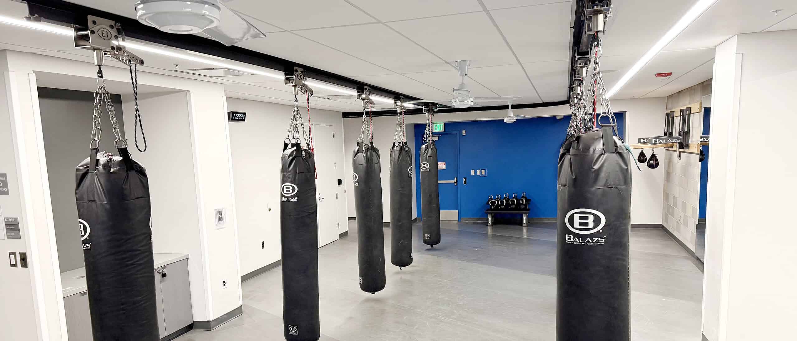 Heavy bags deployed along an Ultra-Trak ceiling track with the track visible overhead
