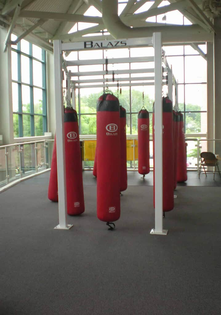 Balazs Ultra-Grid free-standing frame carrying nine heavy bags, anchored to the floor with no ceiling attachment
